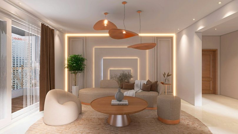 Modern living room with beige furniture, warm lighting, and a round coffee table in Naples, FL.