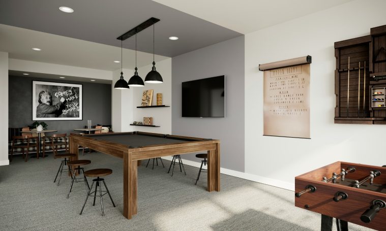 Modern game room featuring a pool table, foosball table, and stylish decor in North Naples.