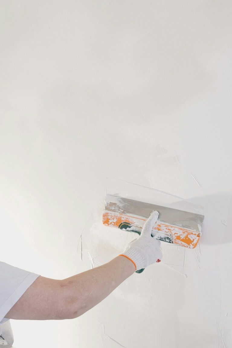Handyman repairing drywall in North Naples.